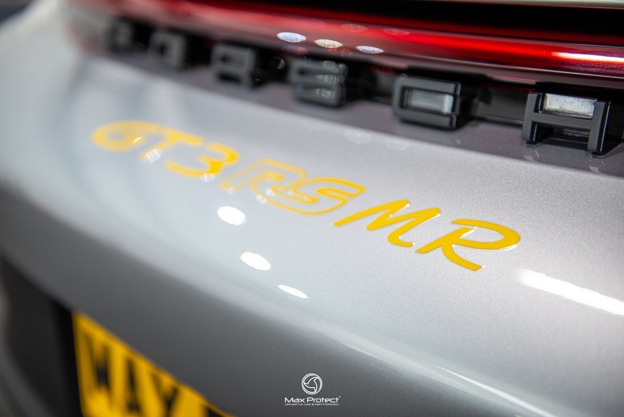 Porsche GT3 RS MR rear decal detail showing GT3 RS MR lettering in yellow