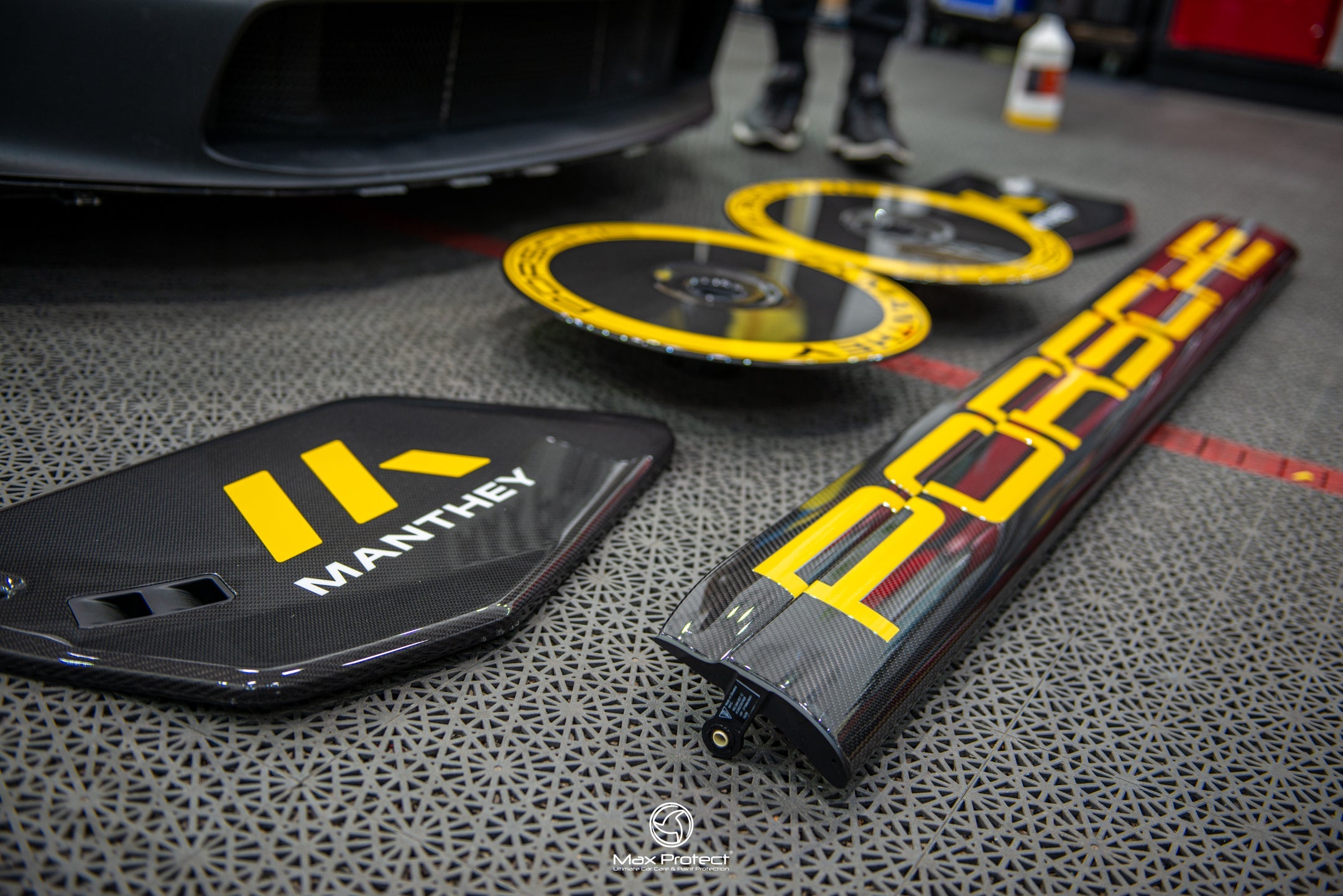 Full Manthey Racing MR decal set laid out - wheel discs, mud flaps and PORSCHE script for GT3 RS